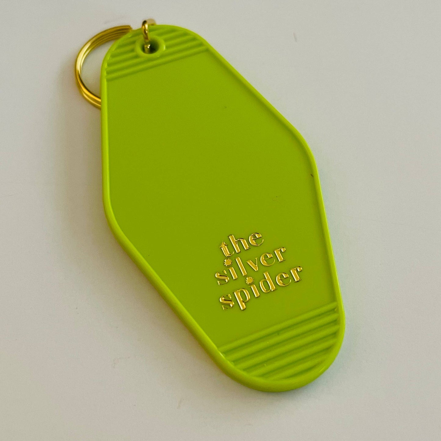 Damn the man keychain